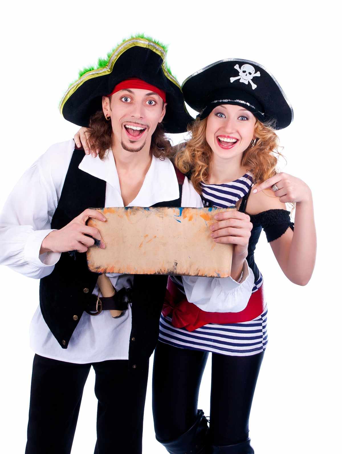 DIY pirate costumes for couples A man and woman wearing DIY pirate costumes, holding a blank scroll of paper.