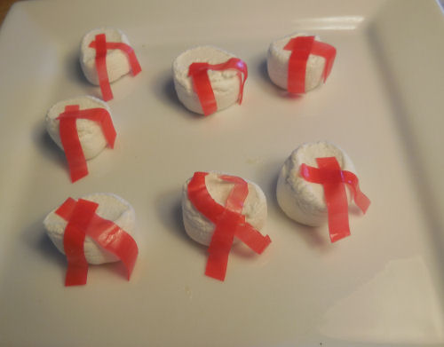 Marshmallows with scarves made up of fruit rollups.
