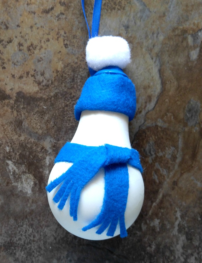 Attach the scarf and cut the ends of it