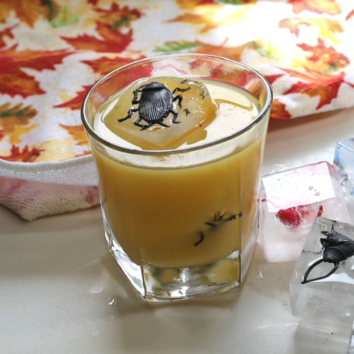Halloween drink with cockroach ice cube