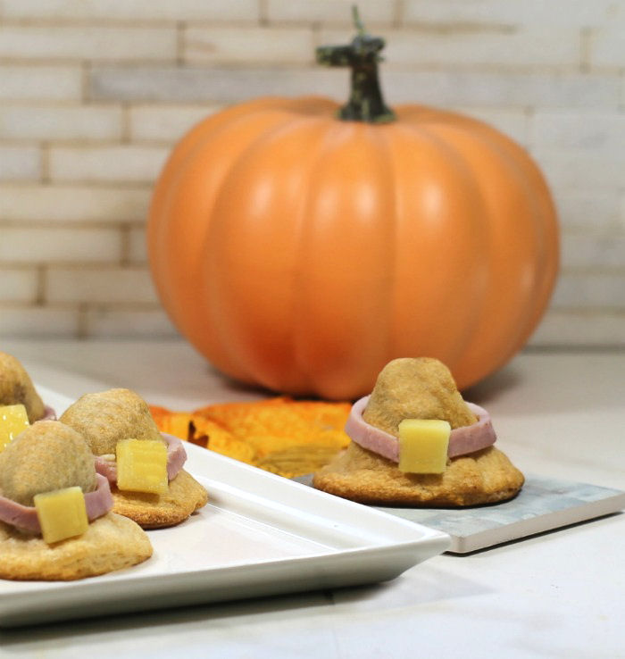 Pilgrim hat appetizer. Pumpkin with an appetizer shaped like a Pilgrim hat.