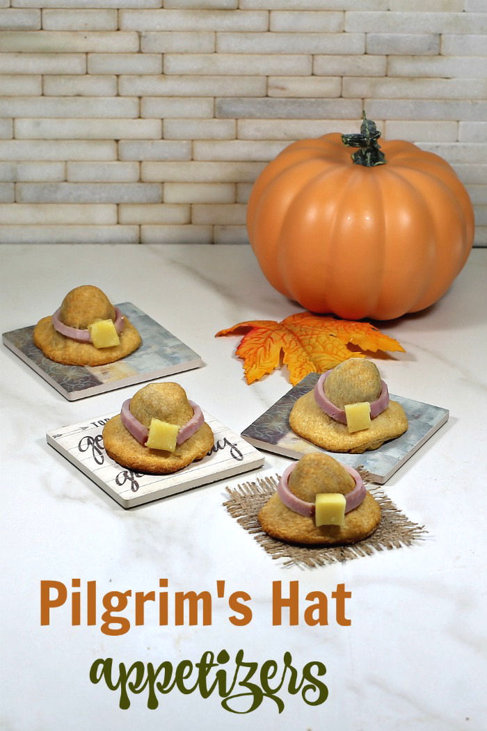 Pilgrim's hat appetizers. Appetizers with pumpkin and leaves and words reading Pilgrim's Hat appetizers.'