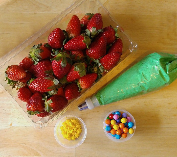 Supplies to decorate the Christmas tree cupcakes