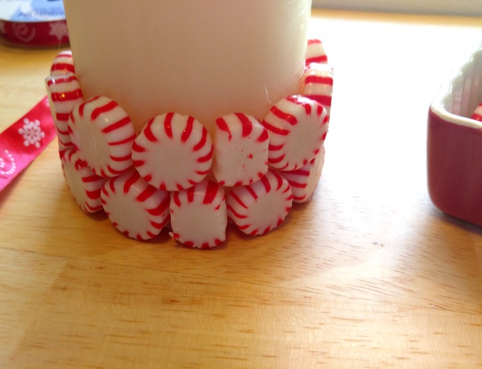 peppermints on a candle Trim peppermints to fit the diameter of the candle