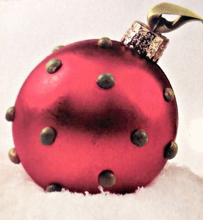 Plain red ornament gets a face lift with dried split peas glued on to make polka dots.