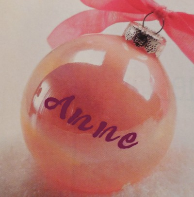 DIY hand painted personalized ornament with the word "Anne" on it.