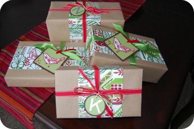 Pottery barn shopping bag recycled into new gift wrap on presents in the trunk of a car.