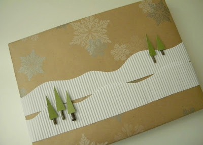 Snowy mountain scene gift wrap on a rectangular present.