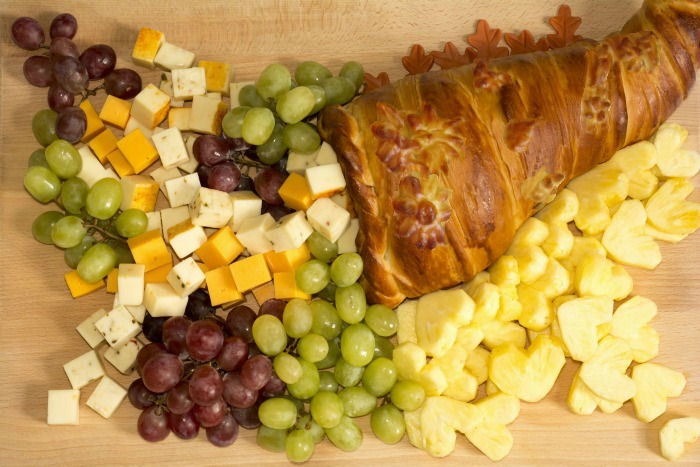 Baked cornucopia Edible cornucopia filled with fruit and cheese.