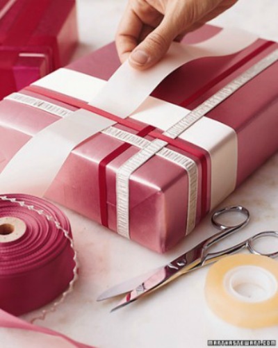 Woven ribbon gift wrapping on a red package.