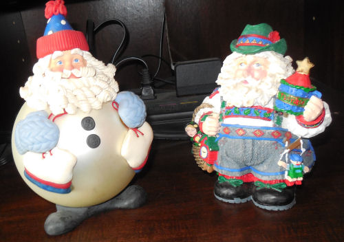 Two round Santa Claus figures.