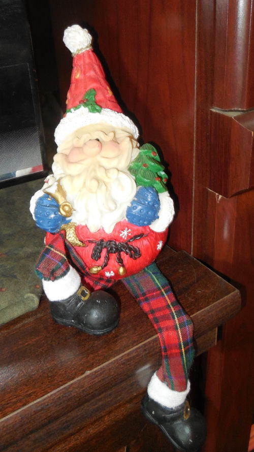 Little Santa Claus elf on a shelf.