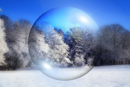 Winter scene through a glass ball. Winter scene through a glass ball.