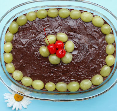Coconut chocolate dessert with grapes for luck