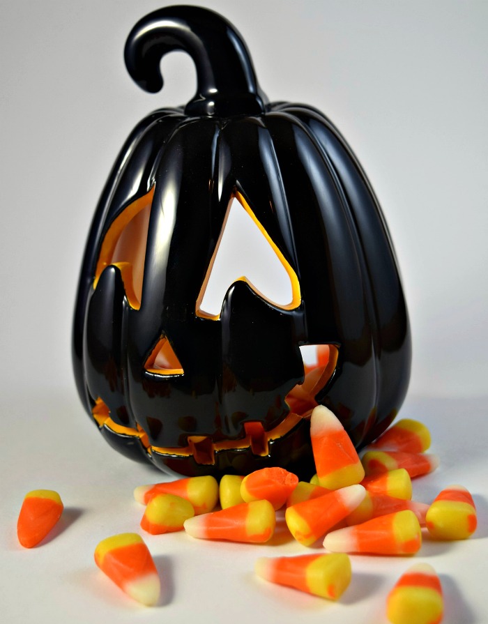 black pumpkin with candy corn Candy corn and black pumpkin