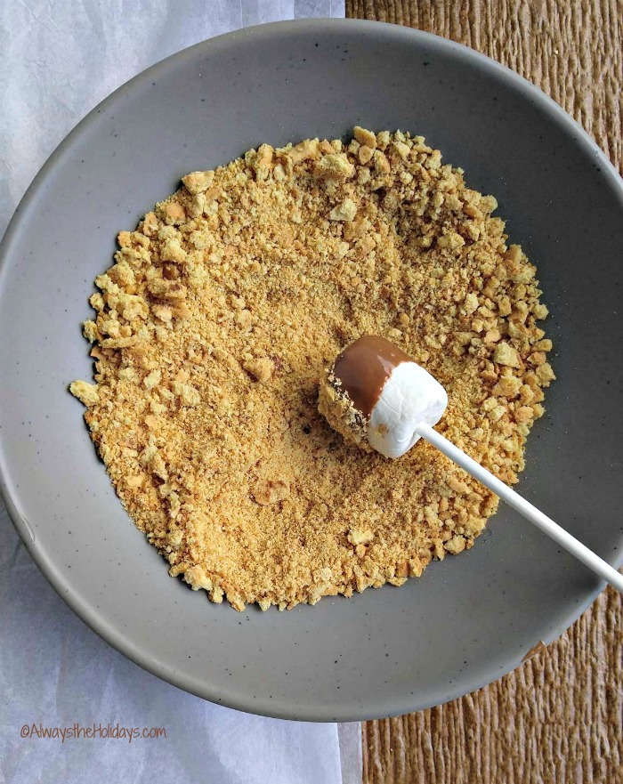Rolling marshmallows in crumbs