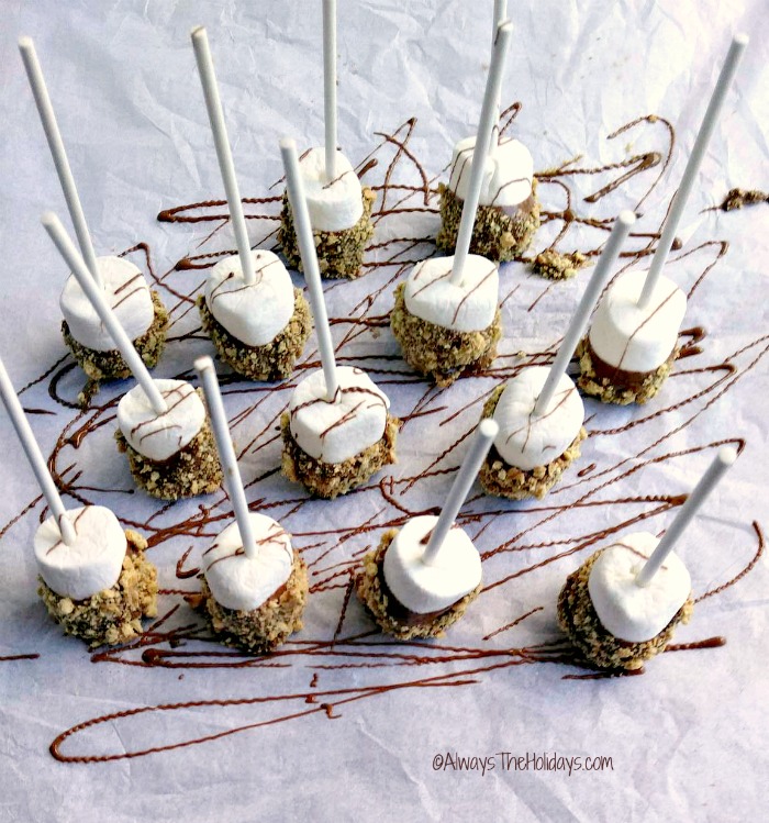 Place s'mores on paper and drizzle in chocolate