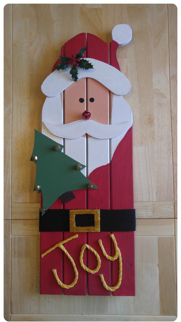 This adorable Santa Claus wall hanging is made from recycled wood from an old door frame. He adds a nice rustic Christmas decoration to your holiday decor.
