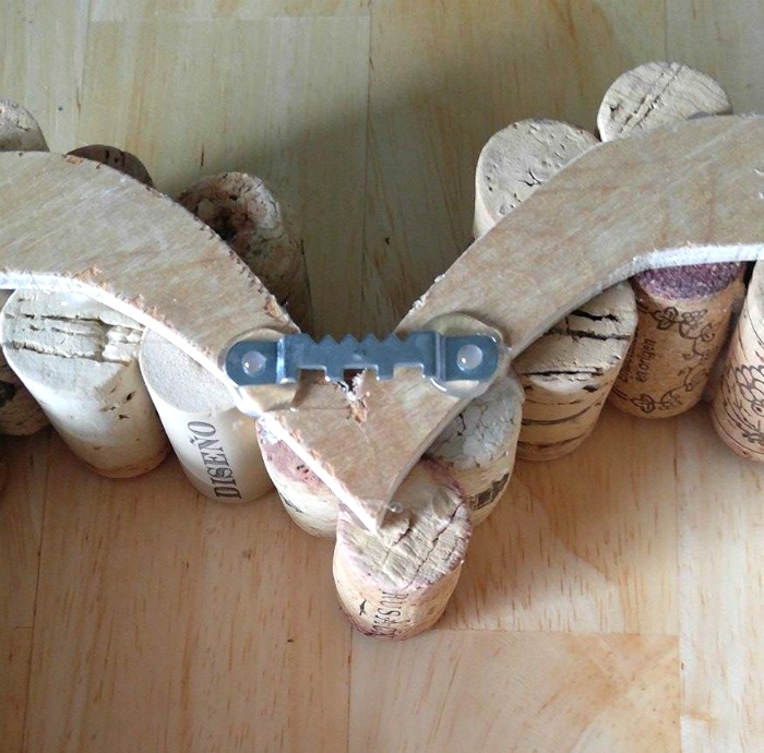 Attach a metal saw tooth hanger