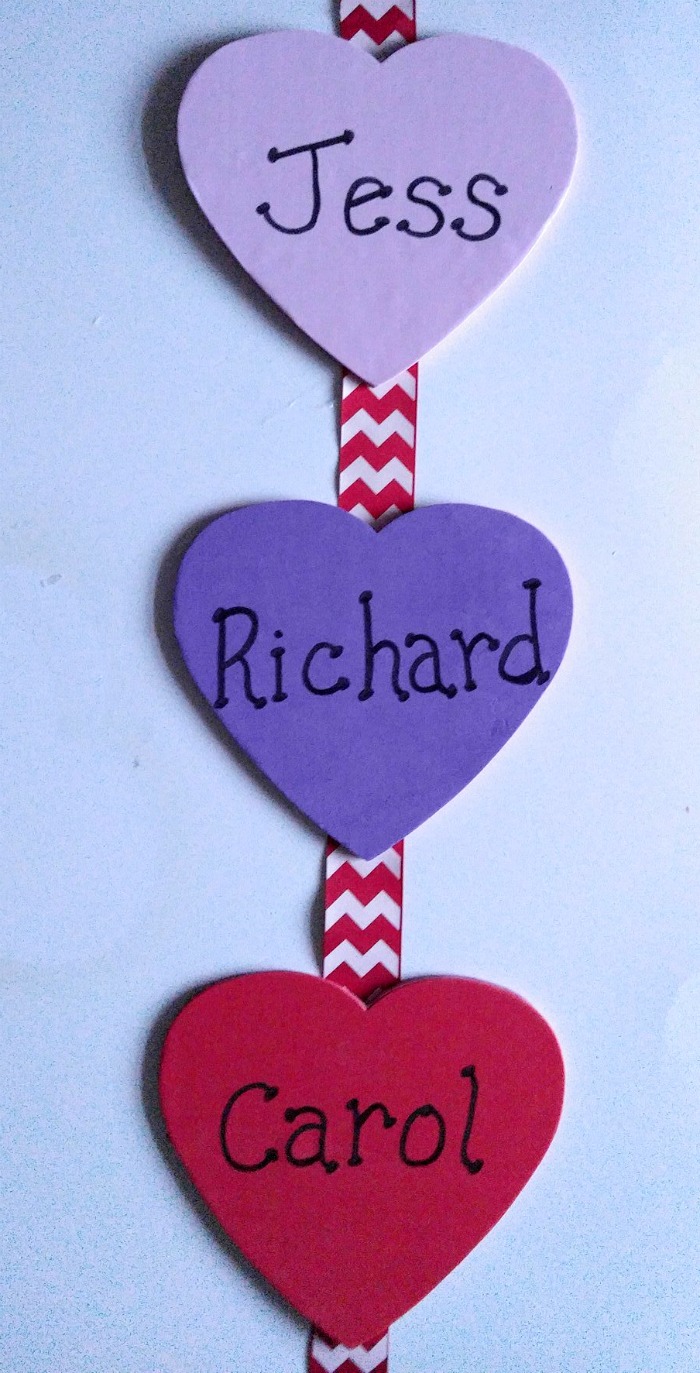 Space the foam wooden hearts evenly on the ribbon
