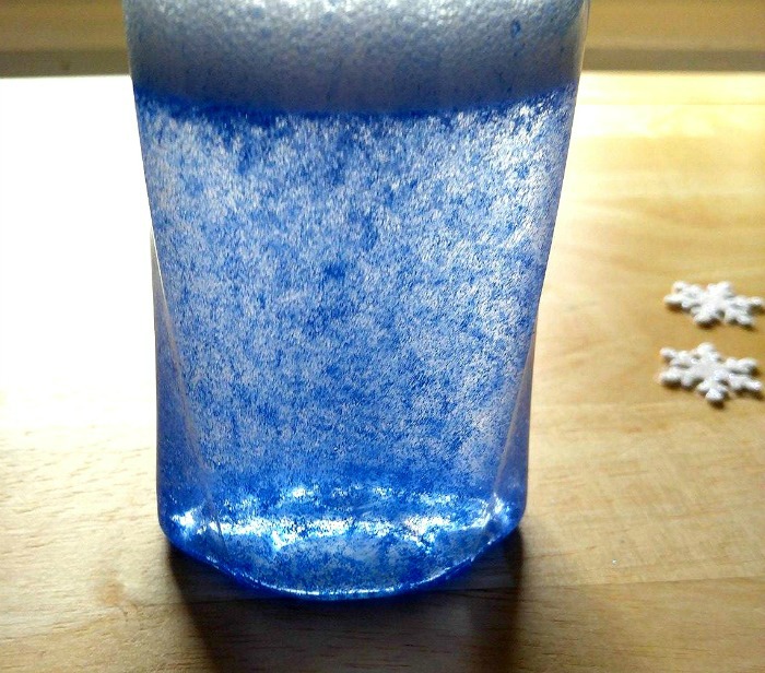 Glue glitter throughout a jar of water.