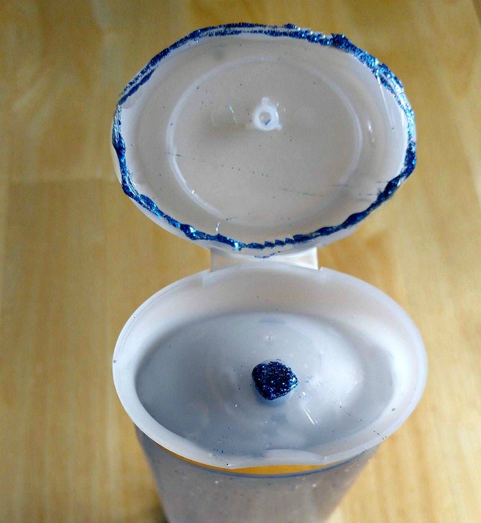 Seal the edges of the top with a blue glitter glue stick