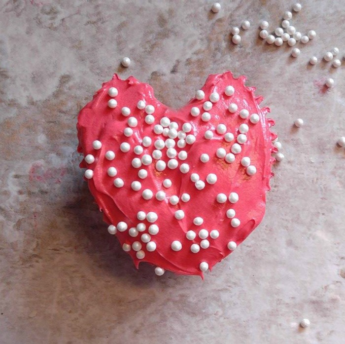 Heart shaped cupcake with pearl sprinkles