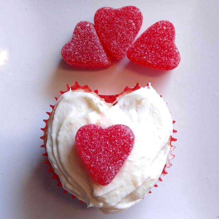 Add a cherry jelly heart to a heart shaped cupcake