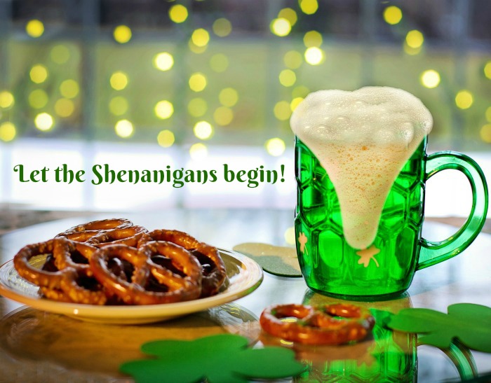 Beer, pretzels and St Patrick's Day quote. A green beer and plate of pretzels on a table with a St. Patrick's Day drinking quotes text overlay.
