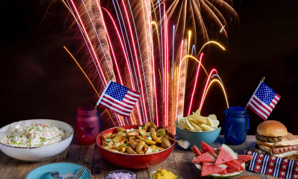4th of July party table 4th of July party table with flags , food and sparklers.
