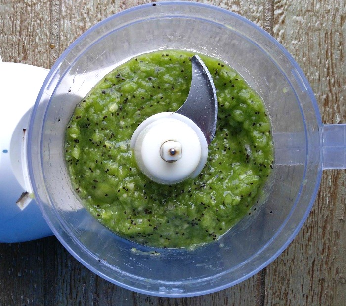 Kiwi fruit in a food processor Pulsed kiwi fruit