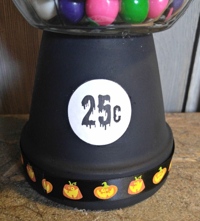 Attach the label to the gumball machine. Spooky 25c Halloween label glued to the front of a Halloween gumball craft project.