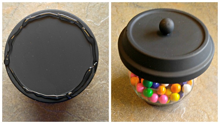 Glue the jar lid to the bowl. Adding hot glue to a jar lid and attaching it to a black painted clay pot. This covers the bowl with the bubblegum in it.