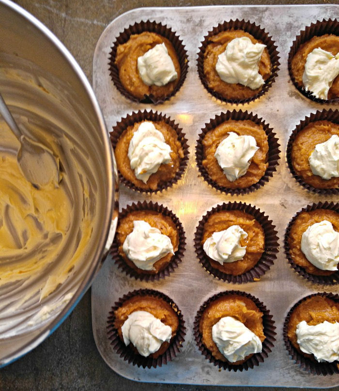 cheesecake mix on pumpkin batter Add the cream cheese layer to the pumpkin muffin batter