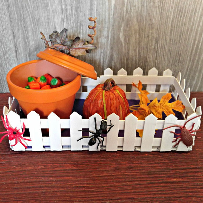 Pumpkin candy dish in graveyard