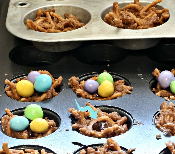 Add some chocolate to hold the eggs Add some chocolate to fasten the eggs
