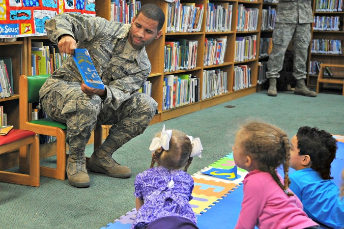 Soldier reading to children Reading time with Dr. Seuss