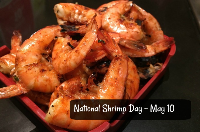 shrimp on a plate with a text overlay National Shrimp Day is May 10