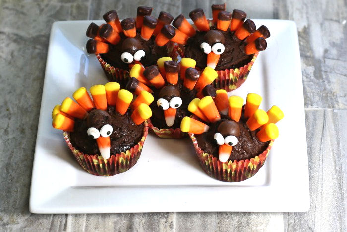 Finished turkey cupcakes cute turkey cupcakes made with candy corn on a white plate
