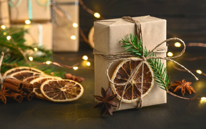 Eco-friendly package with greenery, dried citrus and star anise.