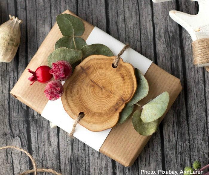 Christmas gift with eucalyptus, wood and seeds.