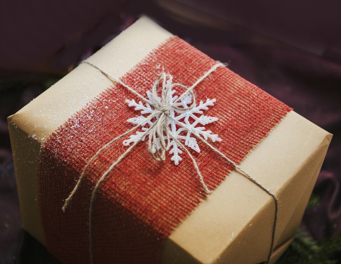 Christmas gift with red burlap ribbon and a three dimensional snowflake.