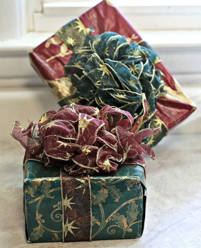 Christmas gifts with floral bows Red and green Christmas gifts with wire edged bows