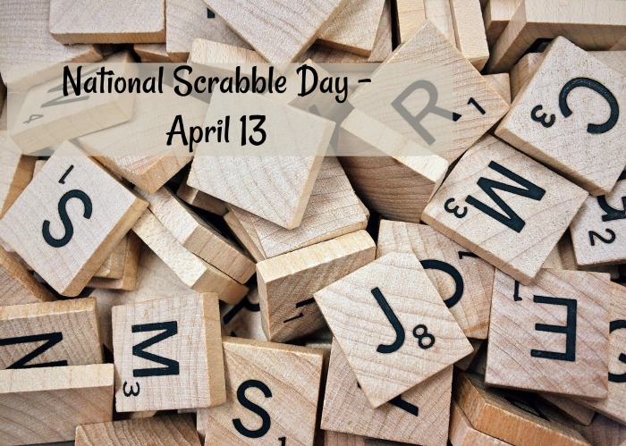National Scrabble Day text over Scrabble tiles. A pile of Scrabble tiles with a text overlay reading "National Scrabble Day, April 13".