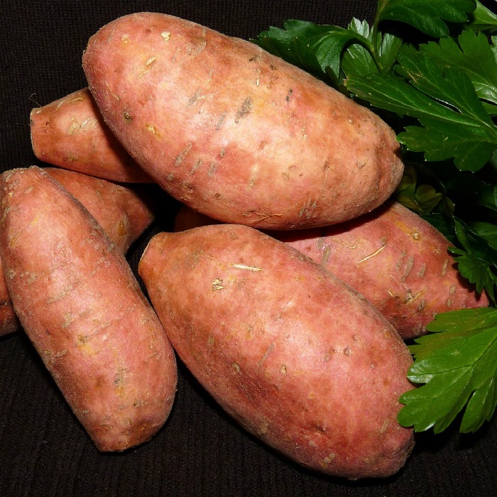 A close shot of sweet potatoes against a background.