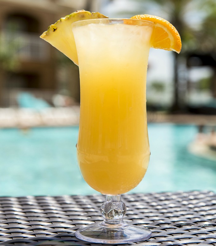 day at the pool with a mimosa Lazy day by the pool with a cocktail