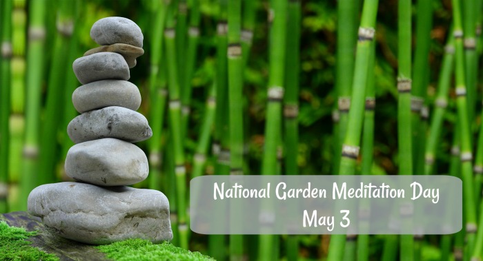 A tower of grey stones in front of a bamboo forest with a text overlay for National Garden Meditation Day on May 3.