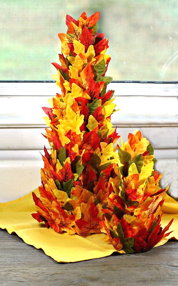 Two DIY tree centerpiece on a yellow napkin.