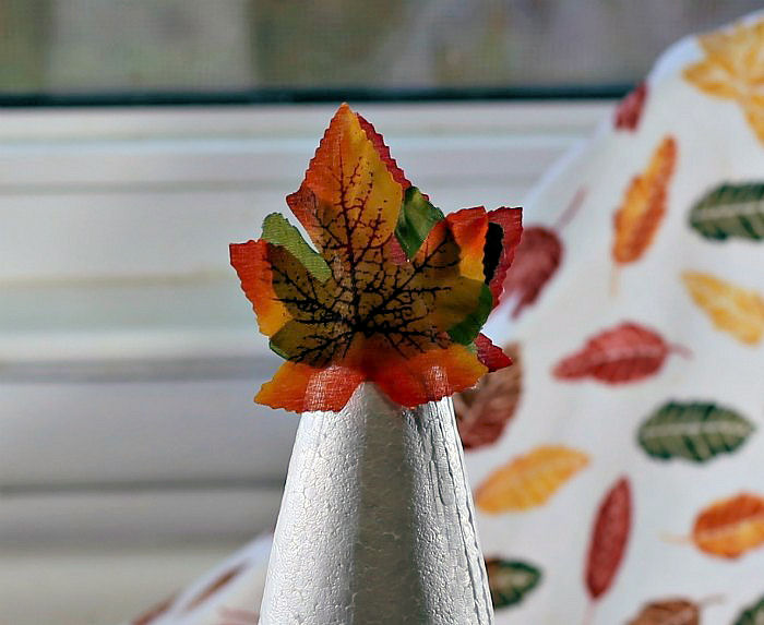 top of the leaf tree on a floral cone Top of the leaf tree with silk leaves.