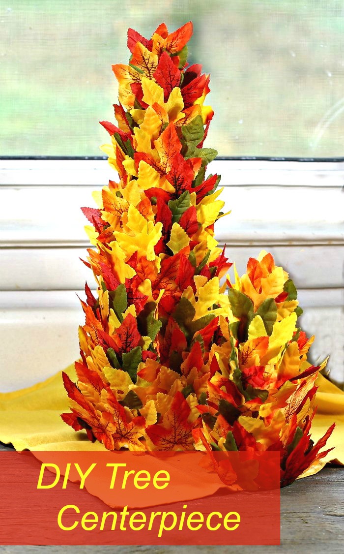 Thanksgiving tree centerpiece. Two cones covered in silk leaves with words reading "DIY tree centerpiece."